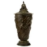 A bacchanalian decorated patinated bronze covered vessel circa 1860