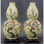 Pair of Chinese Famille Rose double gourd vases with apryochal Kangxi seal mark