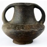An Etruscan style bucchero two handled vessel