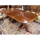 A Georgian crossbanded mahogany double pedestal dining table