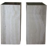 A pair of modern travertine presentation pedestals