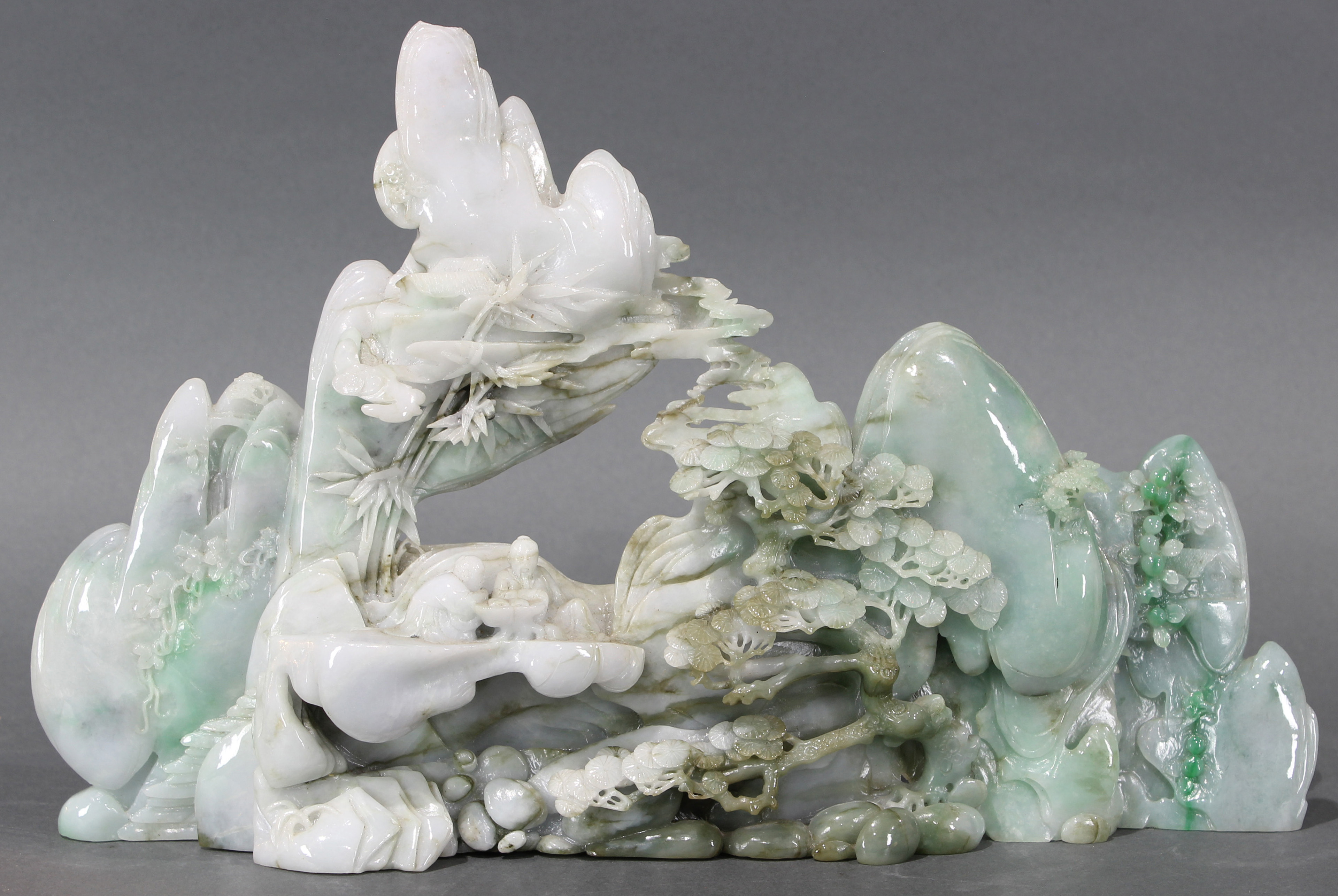 Chinese nephrite pictorial carving of mountain carved from pale green stone