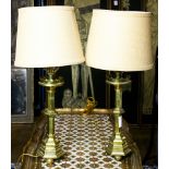 A pair of continental brass candlestick form table lamps