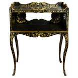 A Napoleon III style ebonized and partial gilt tiered table
