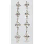 Pair of diamond, 18k white gold earrings