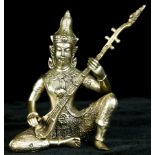 An Indian silverplate figure of a musician with sitar