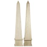 A pair of Classical style large travertine obelisks