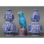 (lot of 3) A Pair of Chinese blue and white double-gourd vases together with a blue ceramic parrot