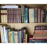 Two shelves of associated books including Treasures of the Hard Rock Cafe