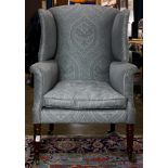 A Victorian upholstered wing back chair