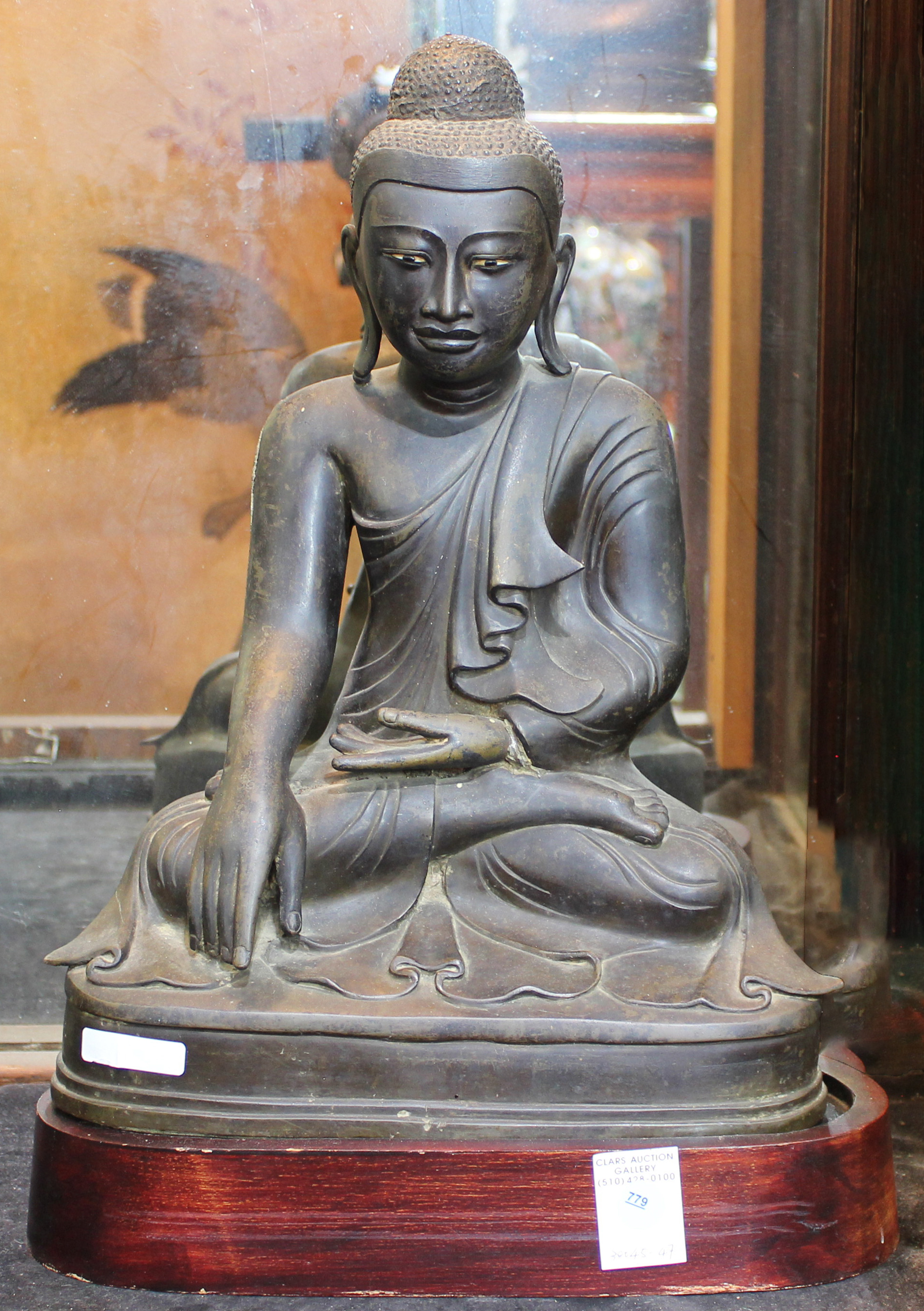 Large Thai seated bronze figure of Buddha with wood stand