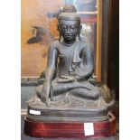 Large Thai seated bronze figure of Buddha with wood stand