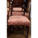 A Regency armchair, having shaped and reeded arms, and rising on turned legs, 34"h x 21"w