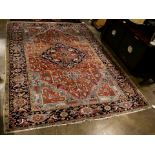 An antique Persian Heriz carpet