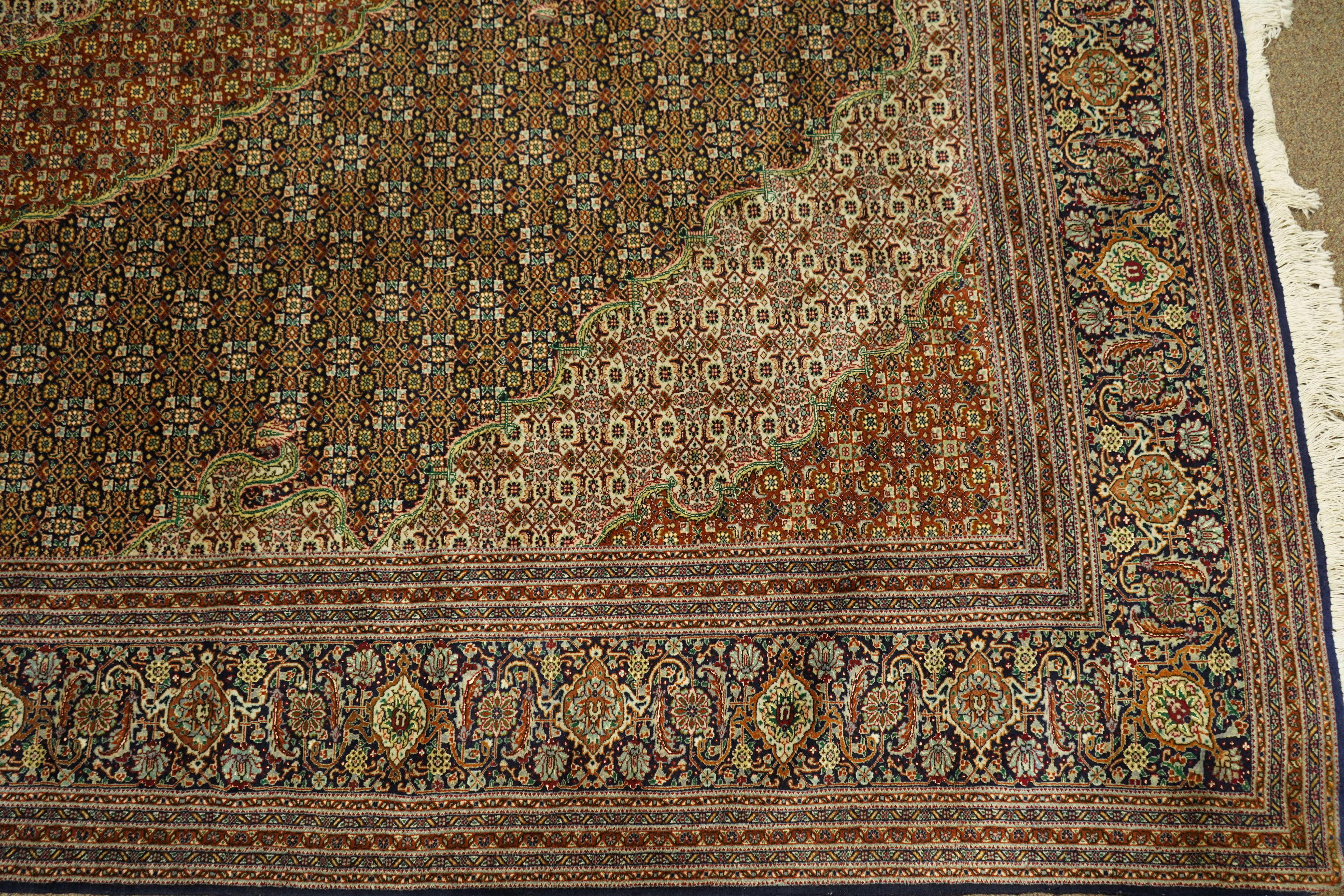 A Persian Mahi Tabriz carpet, 8'4" x 11'3"