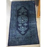 Chinese Baotou cobalt blue ground rug with light blue dragon medallions and fretwork border