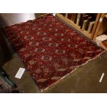 An antique Afghan Bokhara carpet