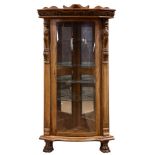 A Victorian style oak corner cabinet in the Horner taste