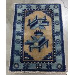 Small Chinese blue and gold rug with antique design
