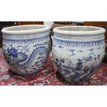 An associated pair of Chinese blue and white pictorial jardinieres