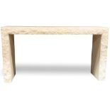 A contemporary travertine console table