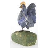 Art glass and rock sculpture of a rooster
