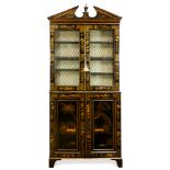 A Regency style lacquered bookcase cabinet
