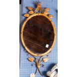 A neoclassical style oval mirror