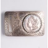 A coin and sterling silver belt buckle