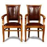A pair of French Directoire style leather armchairs