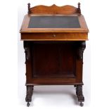 A Victorian davenport desk circa 1870