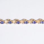 An amethyst, diamond and fourteen karat gold bracelet