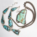 A group of turquoise and silver necklaces