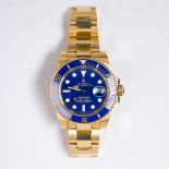 An eighteen karat gold wristwatch, Rolex Submariner, REF: 116618