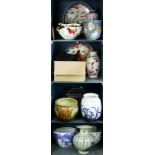 Four shelves of associated Chinese and Asian decoratives