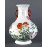 Chinese Famille Rose peony vase with iron red handles