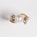 A pearl, diamond and fourteen karat gold ring