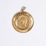 A gold coin and fourteen karat gold pendant