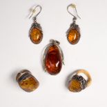 A group of amber and silver jewlery