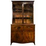 A Sheraton mahogany break front secretary bookcase, circa 1785