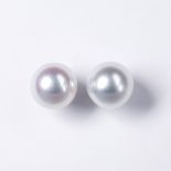 A pair of South Sea pearl and eighteen karat white gold earrings