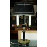 A contemporary black tole decorated bouillotte lamp