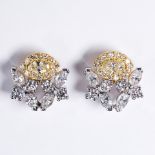 A pair of diamond and eighteen karat bicolor gold earrings