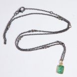 A diamond, eighteen karat gold and blackened silver pendant necklace