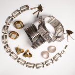 A group of silver and mixed metal jewelry