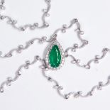An emerald, diamond and eighteen karat white gold pendant necklace