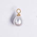 A pearl and fourteen karat gold pendant