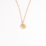 A diamond and eighteen karat gold pendant necklace