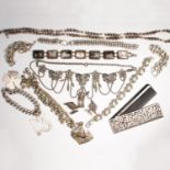 A group of silver jewelry and accessories
