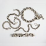 A group of silver bracelets